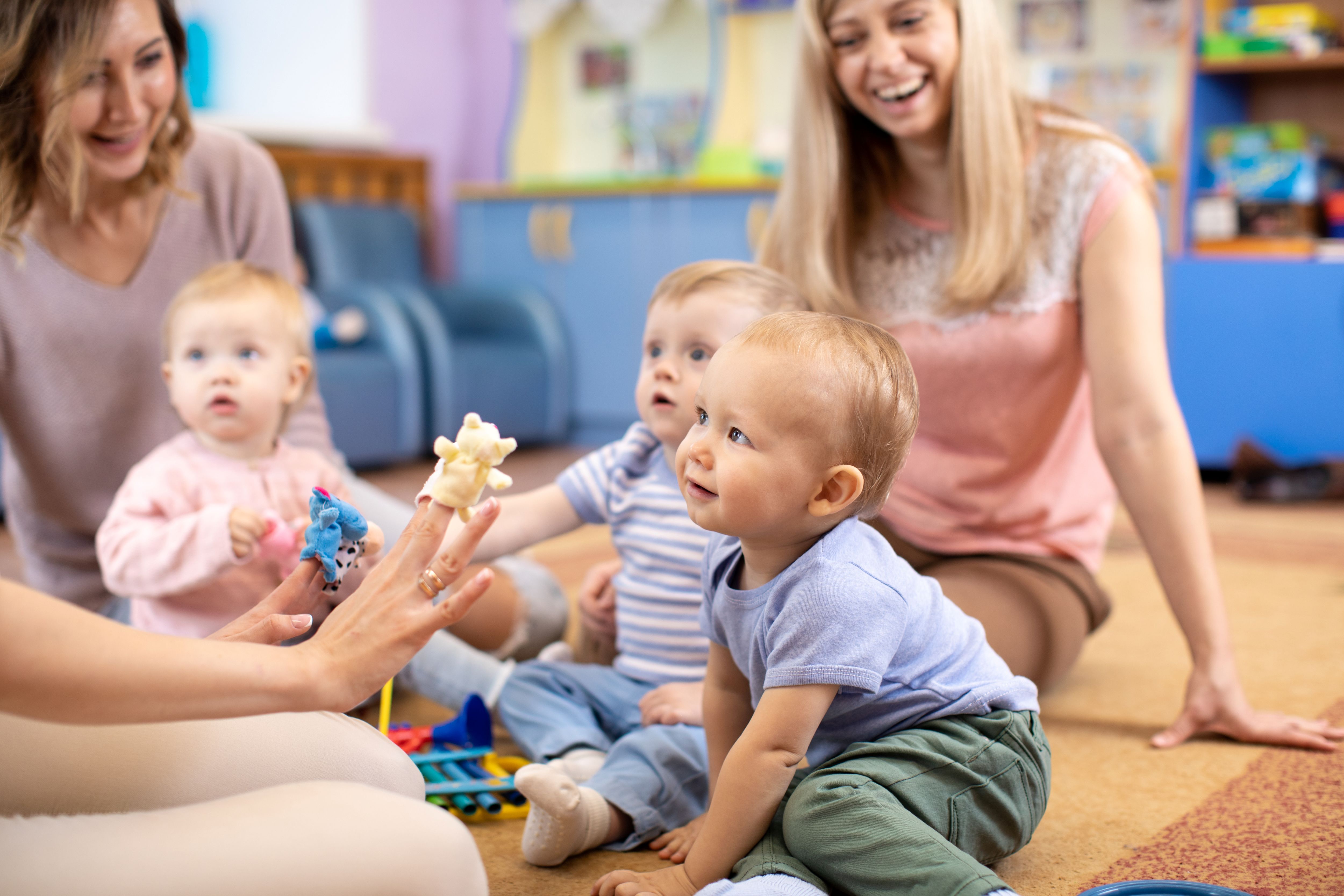 family playing with toys in house